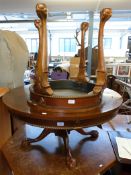 Two circular occasional tables raised on