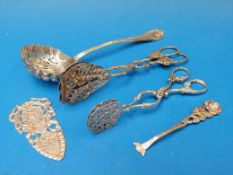 A continental white metal sifting spoon