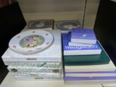 A collection of collectors plates in box