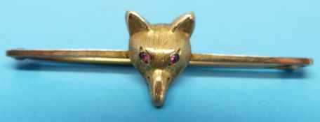 A yellow metal brooch marked 9ct modelle