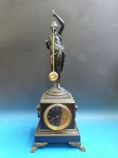 A figural mystery clock in slate on ebon