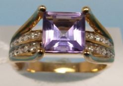 A 9ct gold ring set with an amethyst and
