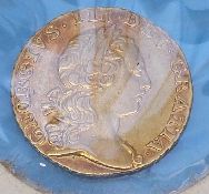 A 1762 George III gold quarter guinea