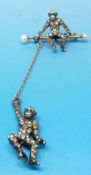 A brooch modelled as a monkey seated on