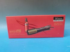 A boxed TREsemmé Smooth Volume Hot Air S