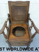 A carved oak commode (width 47cm, depth