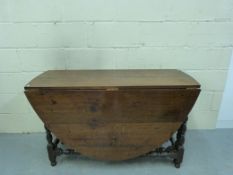 An oak drop leaf table (L120cm x H74cm)