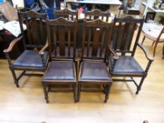A set of six (4+2) oak upholstered dinin