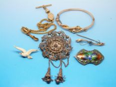 A 9ct gold bangle with twist design, a 9