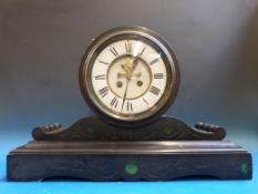 A 19thC black slate mantel clock, the ci