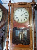 An American wall clock with ornate marqu