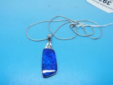 An 18ct white gold pendant set with an i