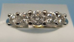 An 18ct white gold ring set with five ro