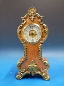 A small walnut cased ornate balloon styl