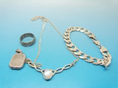 A white metal locket, bracelet, necklace