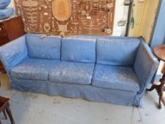 A blue three seat sofa retailed by Harro