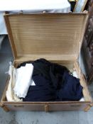 An ash bound trunk with textiles inside