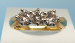 An 18ct gold ring set with three diamond