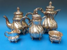 A white metal teapot, height 25 cm, and