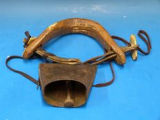 A 19thC goat yoke and cow bell, probably