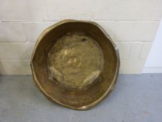 A large C19th brass bowl (diameter 86cm)