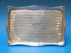 A hallmarked silver tray with engine tur