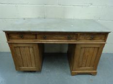 A marble-topped pitch pine twin pedestal