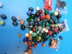 A collection of glass beads and lacquer