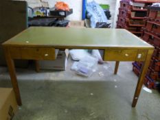 A light oak desk fitted two drawers (wid