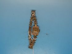 A 9ct gold ladies watch on an unusual 9c