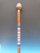 A knobkerrie with bulbous top, beaded mi