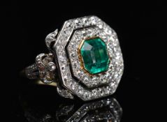 A gold and platinum ring set with a larg