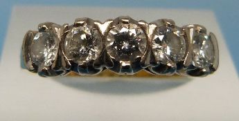 An 18ct gold ring set with five diamonds