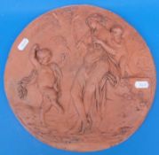 A 19thC circular terracotta plaque with