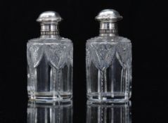 A pair of early 20thC Fabergé glass bott