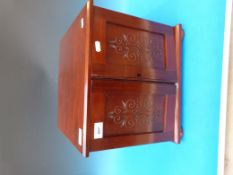 A mahogany coin collectors cabinet with