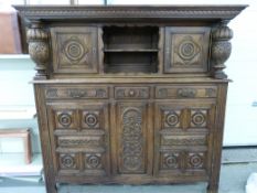 A large carved oak hall cabinet / sidebo