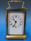 A French brass carriage clock with Roman