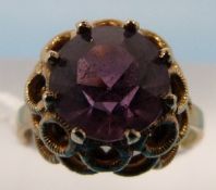 A 9ct gold ring set with a large amethys