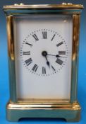 A French brass carriage clock with Roman