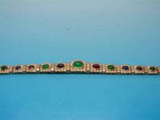 An 18ct gold bracelet set with emerald,