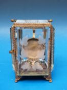 A pocket watch display holder in fine gl