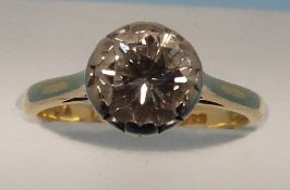 An 18ct gold ring set with a round brill