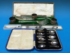 Three hallmarked silver napkin rings (58