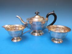 A three-piece hallmarked silver tea set,