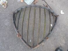 A cast iron corner hay rack.