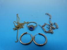 A blue and clear stone cluster ring stam