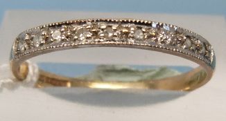 A 9ct gold ring set with nine diamonds (