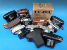 A box of 15 old 35mm cameras, some in or