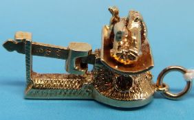 A 9ct gold charm in the form of a baby o